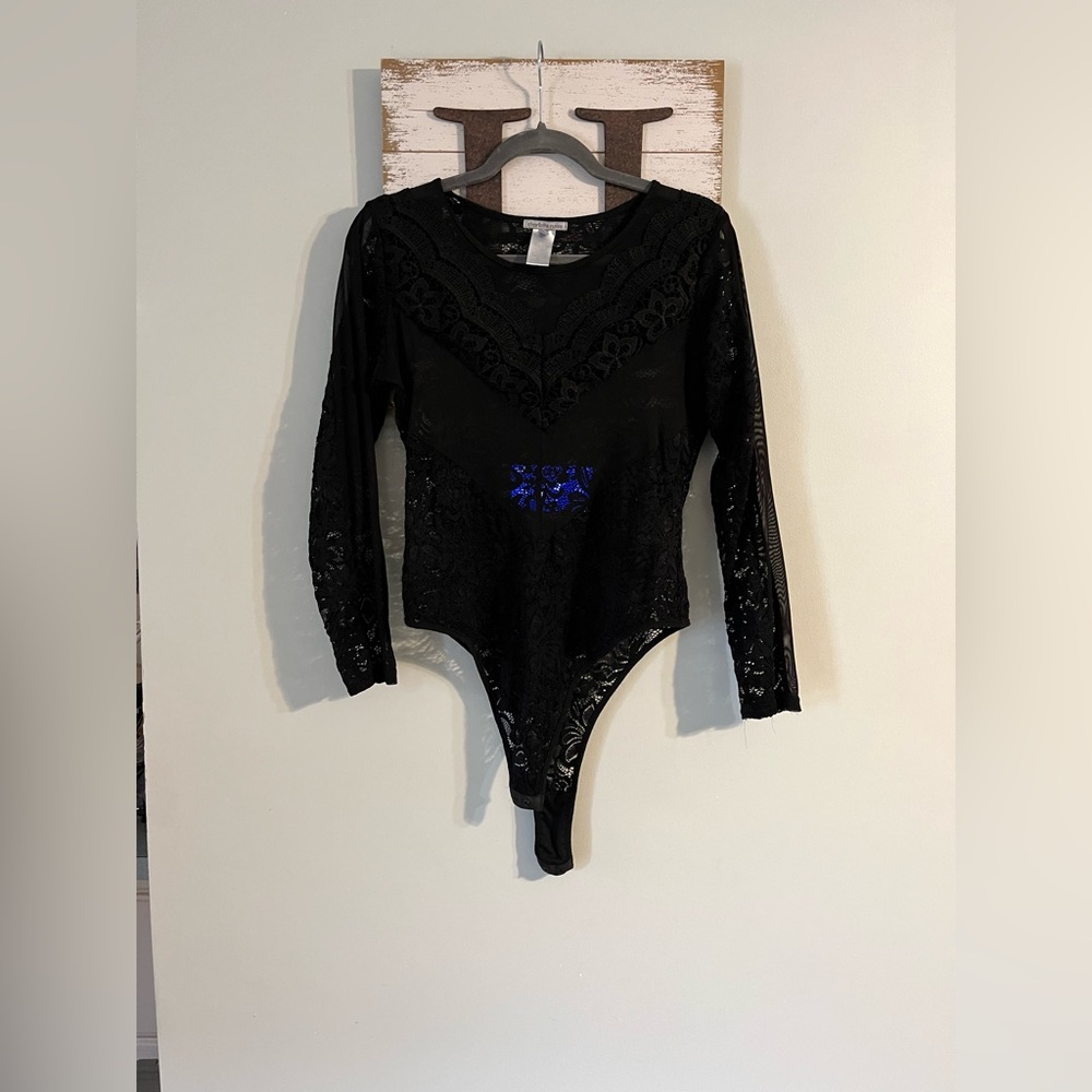 Charlotte Russe sheer black body suit. Size large.